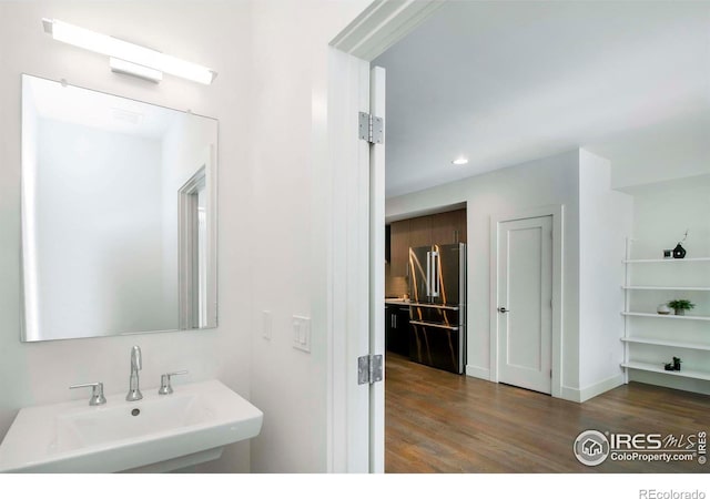 bathroom with sink and hardwood / wood-style floors