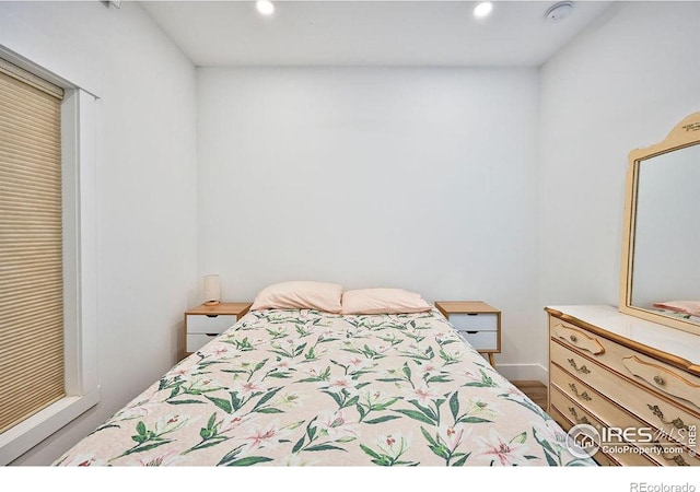 bedroom featuring wood-type flooring