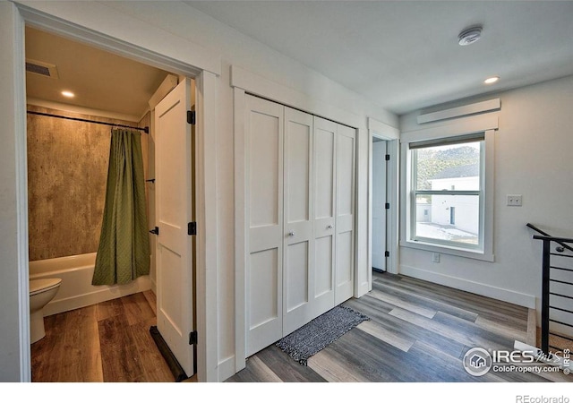 hallway featuring hardwood / wood-style floors