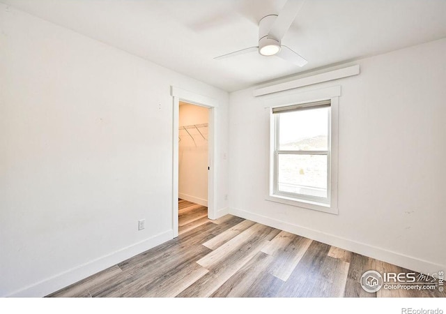 spare room featuring ceiling fan and light wood-type flooring