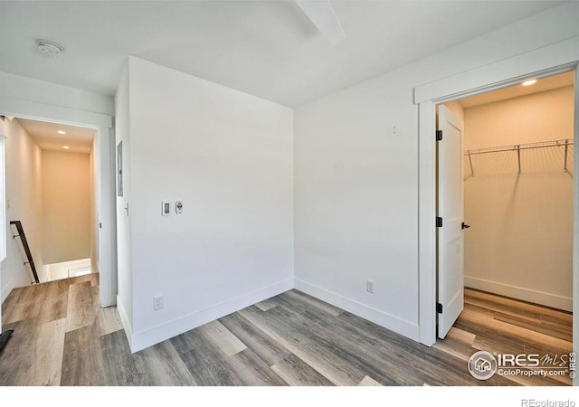 unfurnished room with hardwood / wood-style floors