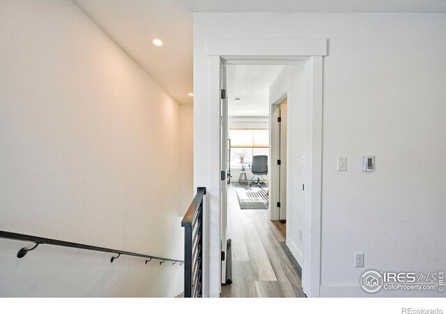 hall with light hardwood / wood-style floors