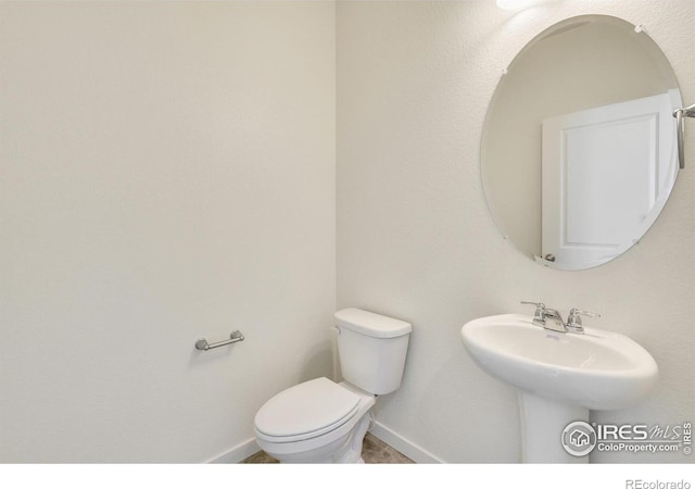 bathroom with sink and toilet