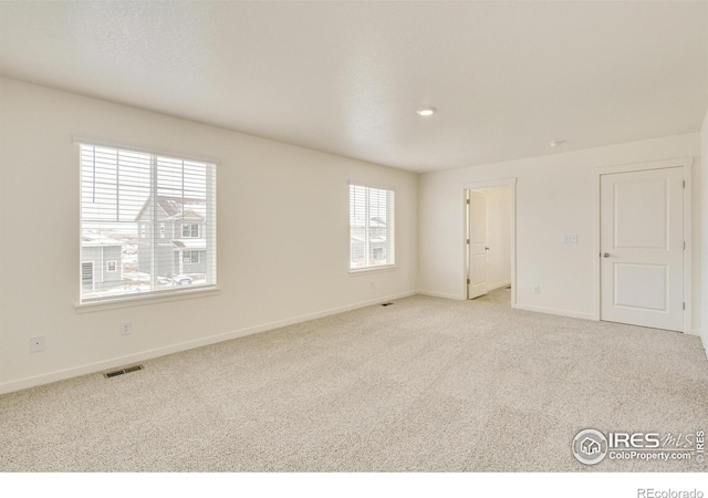 view of carpeted spare room