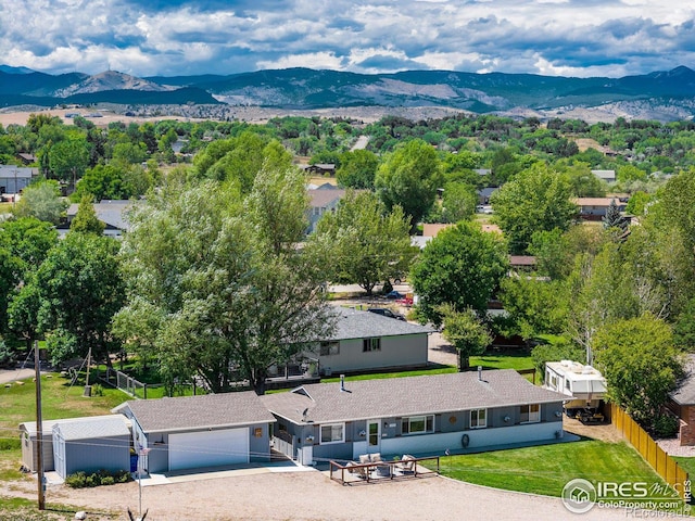 birds eye view of property with a mountain view