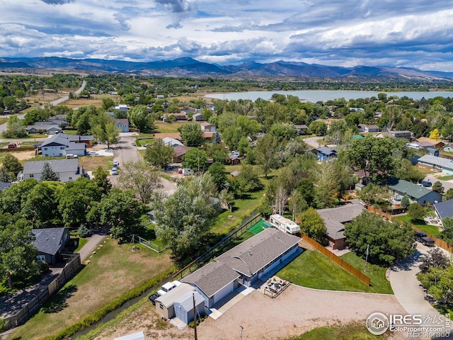 bird's eye view with a water and mountain view