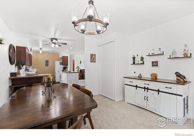 dining area with light colored carpet and ceiling fan with notable chandelier