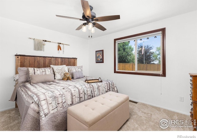 bedroom featuring ceiling fan and light colored carpet