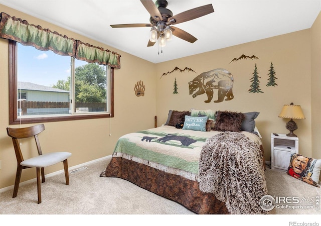 carpeted bedroom with ceiling fan