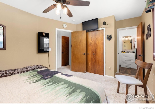 bedroom with connected bathroom, a closet, ceiling fan, and carpet floors