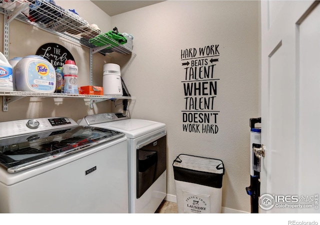 laundry room featuring washing machine and clothes dryer