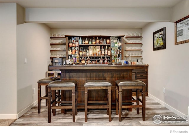 bar featuring hardwood / wood-style floors