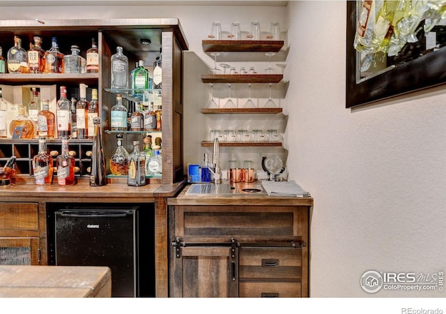 bar featuring beverage cooler