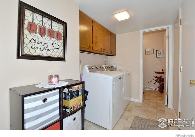 laundry room with cabinets and independent washer and dryer