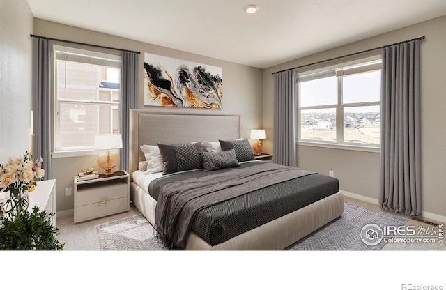 bedroom with light colored carpet