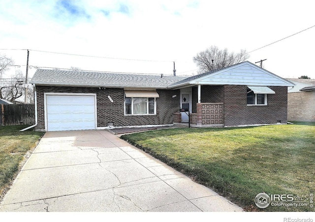 ranch-style house featuring a front lawn and a garage