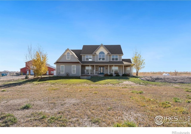 view of front of property with a front lawn and a porch