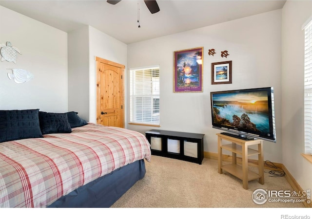 bedroom featuring light colored carpet and ceiling fan