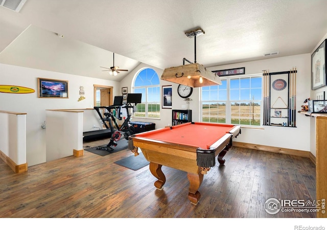 recreation room featuring pool table, vaulted ceiling, hardwood / wood-style floors, and a textured ceiling