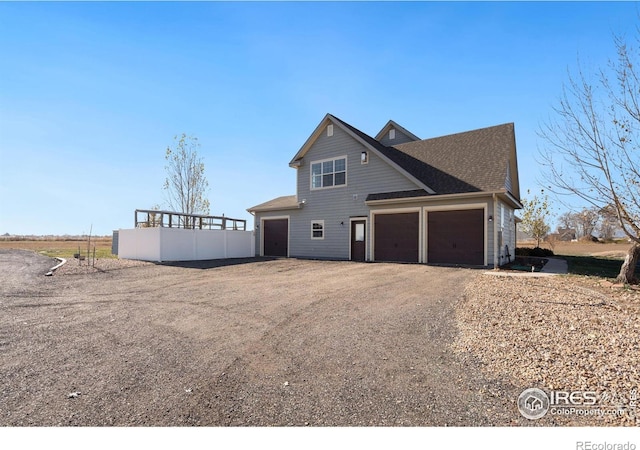 view of side of property featuring a garage