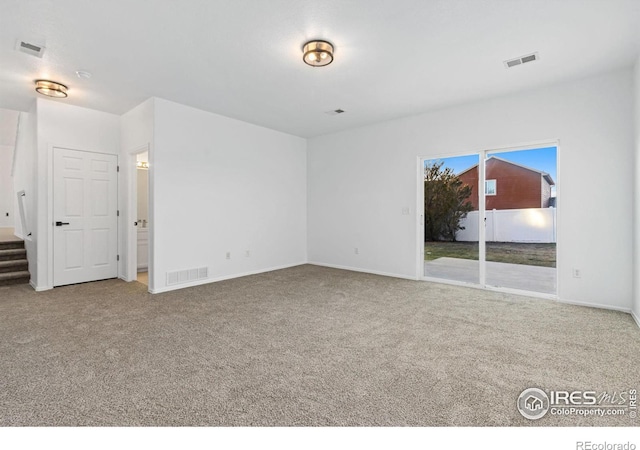 empty room with carpet flooring