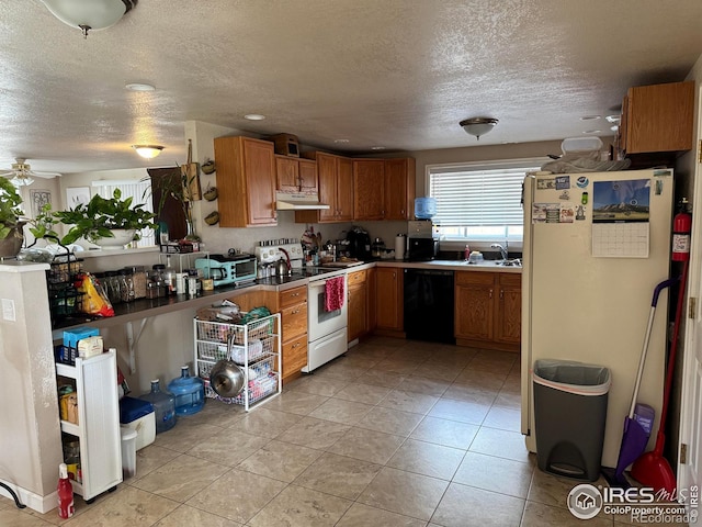 kitchen featuring brown cabinets, light tile patterned floors, a sink, white appliances, and under cabinet range hood