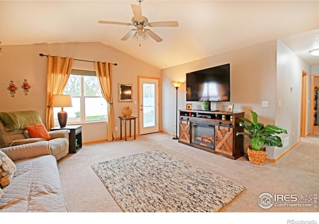 carpeted living room with vaulted ceiling and ceiling fan