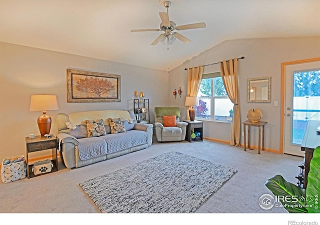 carpeted living room featuring ceiling fan and lofted ceiling