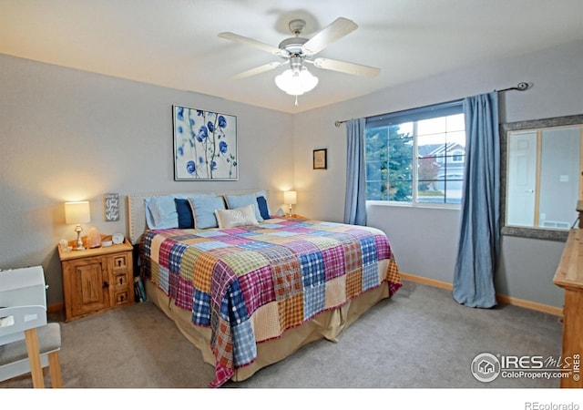 bedroom featuring ceiling fan and light colored carpet