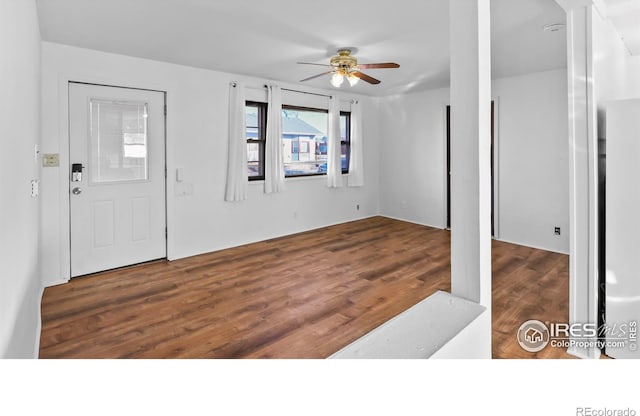 entryway with dark hardwood / wood-style floors and ceiling fan