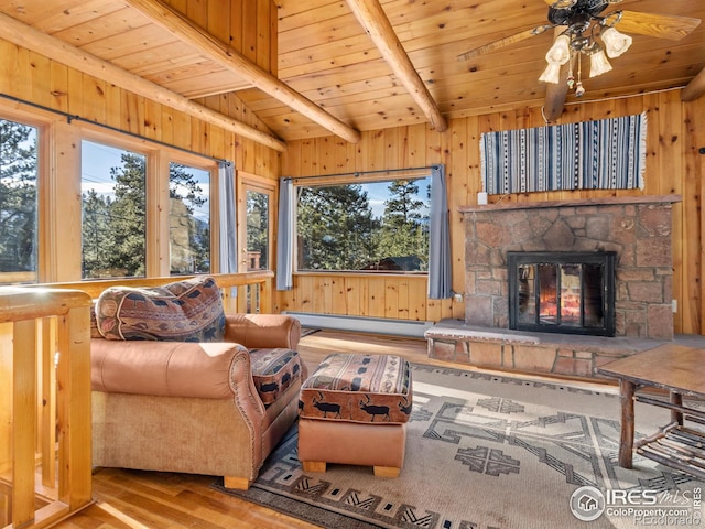 living room with a fireplace, wooden ceiling, a baseboard heating unit, and light wood-type flooring