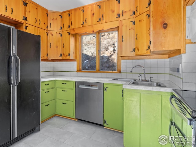 kitchen featuring sink, black refrigerator with ice dispenser, stainless steel dishwasher, backsplash, and light tile patterned floors