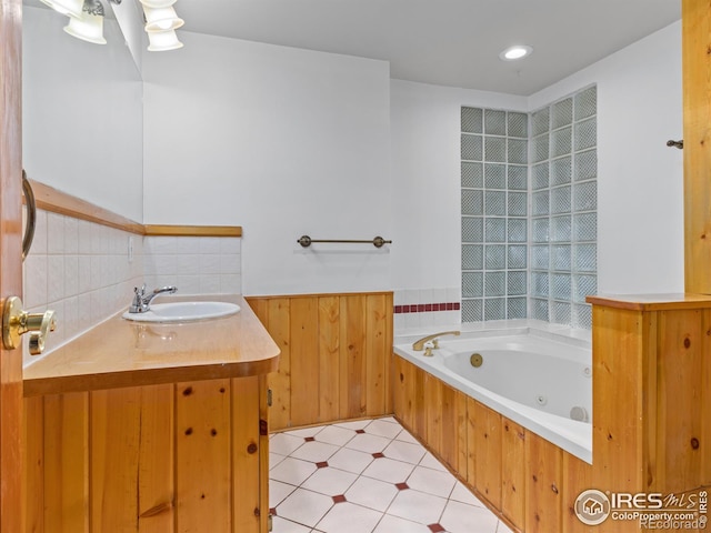 bathroom featuring vanity and a tub