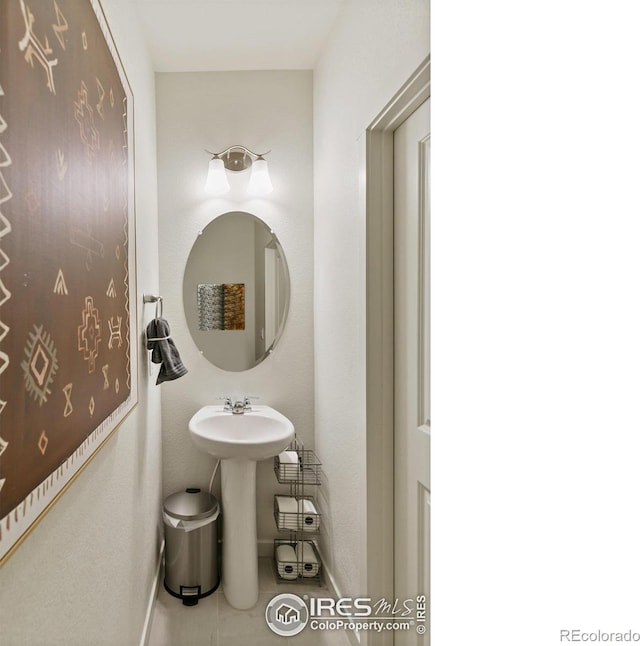 bathroom featuring tile patterned floors and sink