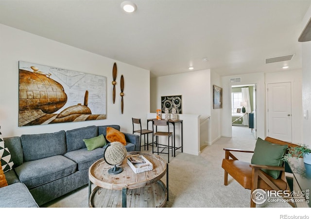 living room featuring light carpet