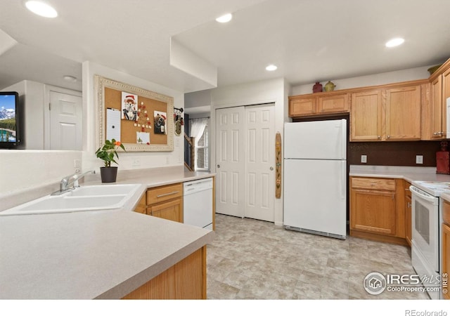 kitchen with sink and white appliances