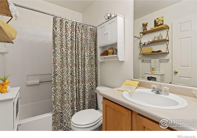 full bathroom featuring shower / bath combination with curtain, vanity, and toilet