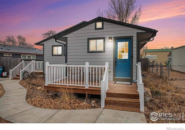 view of front of home with a deck