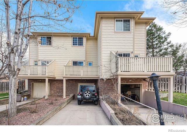 exterior space featuring a garage and a balcony