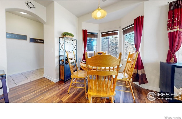 dining space featuring hardwood / wood-style flooring