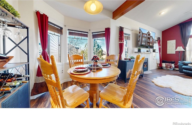 dining space with lofted ceiling with beams and dark wood-type flooring