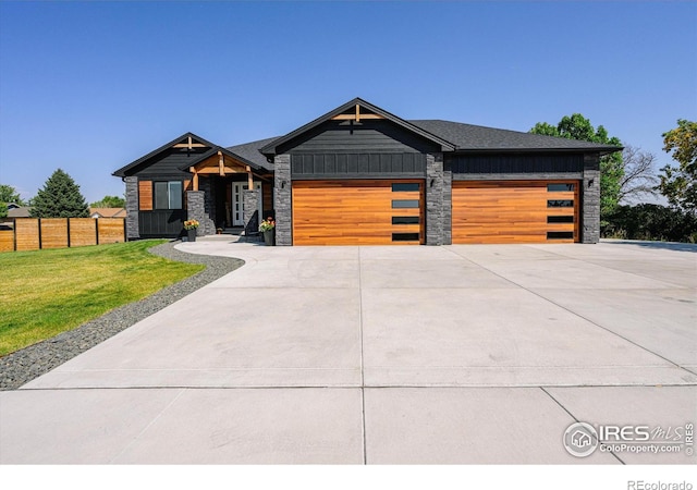 view of front facade with a front yard and a garage