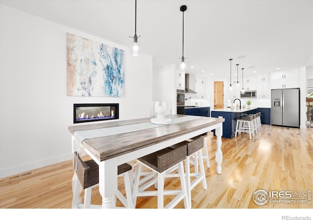 dining area featuring light hardwood / wood-style flooring