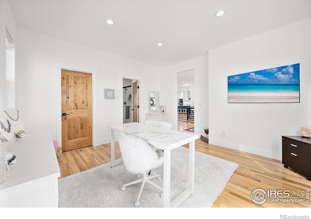 office area with light hardwood / wood-style flooring