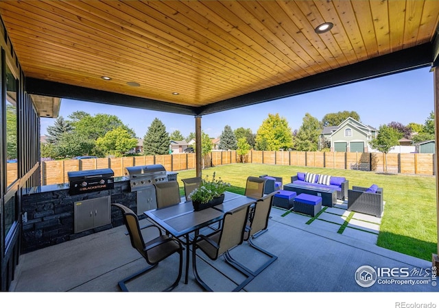 view of patio / terrace with outdoor lounge area, grilling area, and an outdoor kitchen