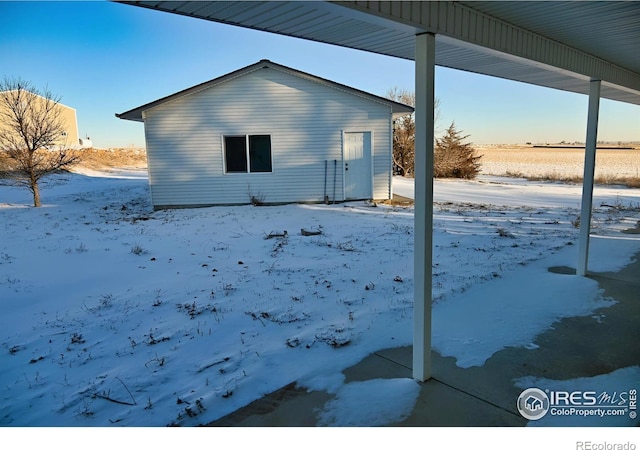 view of snow covered house