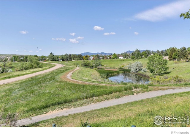 view of home's community featuring a rural view and a water and mountain view