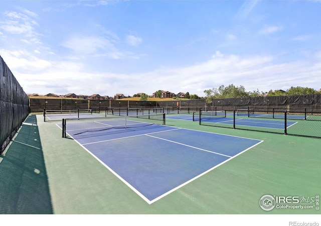 view of sport court with basketball hoop