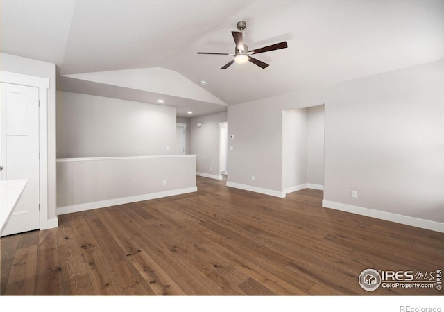 unfurnished room featuring lofted ceiling, hardwood / wood-style flooring, recessed lighting, a ceiling fan, and baseboards