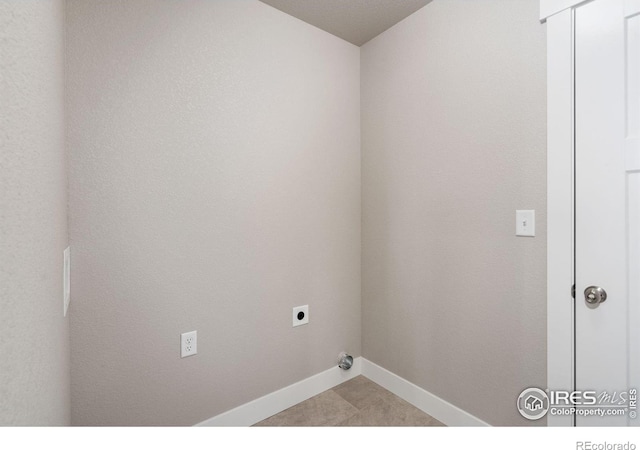 washroom with laundry area, baseboards, and electric dryer hookup